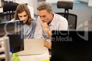 High angle view of business colleagues working together in office