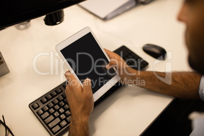 Businessman using digital tablet in office