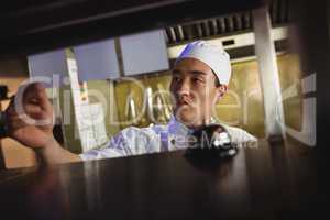 Chef looking at an order list in the commercial kitchen