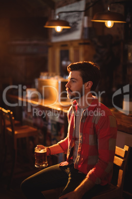 Thoughtful man having beer