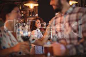 Jealous woman looking at couple flirting with each other