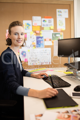 Portrait of photo editor working at office