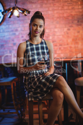 Portrait of young woman using mobile phone