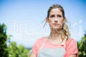 Thoughtful female farmer at vineyard
