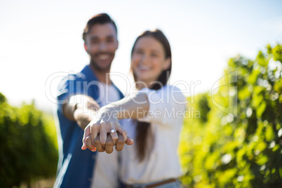 Happy couple holding hands on sunny day