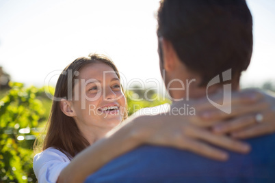 Happy couple embracing at farm