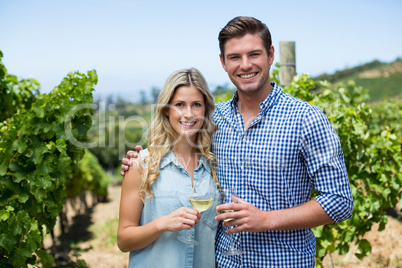 Portrait of couple holding wineglasses