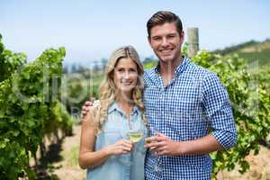 Portrait of couple holding wineglasses