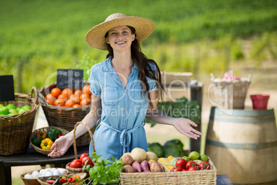 Portrait of smiling woman selling vegetables