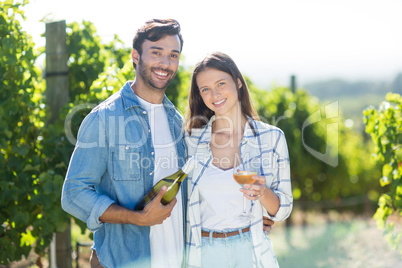 Portrait of smiling couple with wine