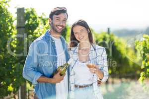 Portrait of smiling couple with wine