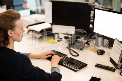 Businesswoman working on computer in office