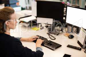 Businesswoman working on computer in office