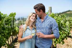Smiling couple holding wineglasses