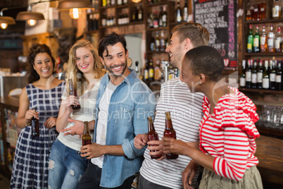 Cheerful friends enjoying at pub