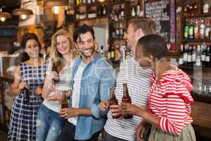 Cheerful friends enjoying at pub