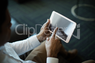 High angle view of businessman using digital tablet