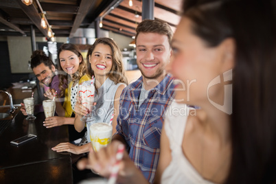 Group of friends having drinks in restaurant