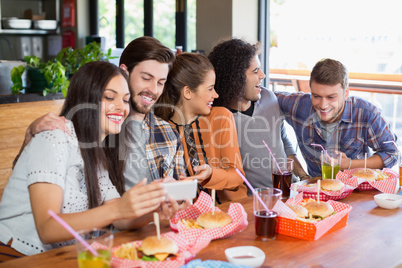 Young friends enjoying in restaurant