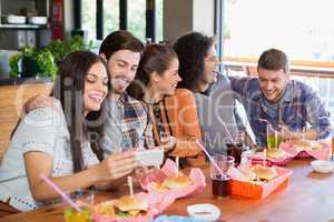 Young friends enjoying in restaurant