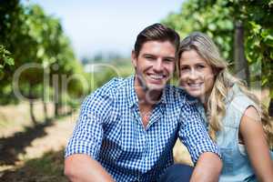 Portrait of happy young couple at vineyard