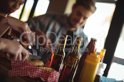 Friends having burger together Friends having burger together