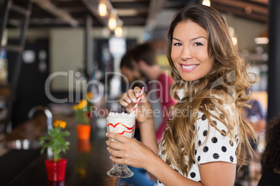 Portrait of woman holding drink