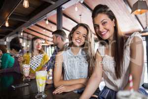 Female friends sitting at restaurant