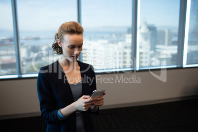 Young businesswoman using mobile phone