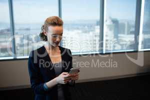 Young businesswoman using mobile phone