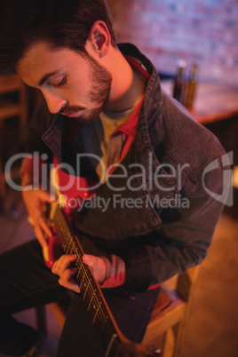 Young man playing guitar