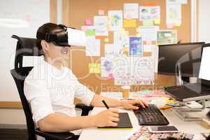 Designer using digitizer and VR glasses while working