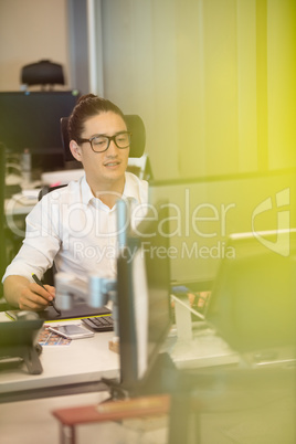 Designer using digitizer on office desk