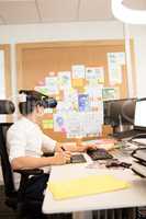 Creative businessman using digitizer and VR glasses