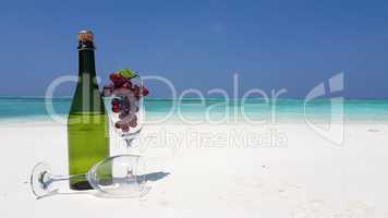 v02017 Maldives beautiful beach background white sandy tropical paradise island with blue sky sea water ocean 4k champagne bottle