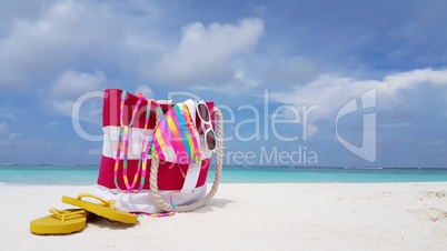 v02391 Maldives beautiful beach background white sandy tropical paradise island with blue sky sea water ocean 4k bag bikini flip flops