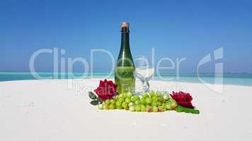 v02457 Maldives beautiful beach background white sandy tropical paradise island with blue sky sea water ocean 4k champagne bottle grapes