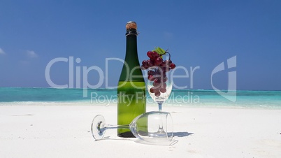 v02469 Maldives beautiful beach background white sandy tropical paradise island with blue sky sea water ocean 4k champagne bottle glass red grapes