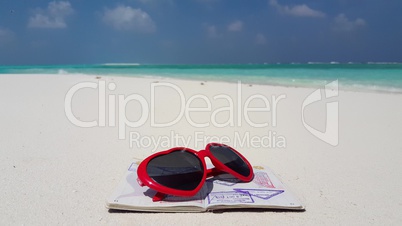 v02783 Maldives beautiful beach background white sandy tropical paradise island with blue sky sea water ocean 4k passport sunglasses