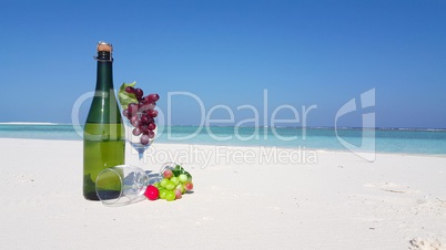 v02787 Maldives beautiful beach background white sandy tropical paradise island with blue sky sea water ocean 4k champagne bottle glass grapes