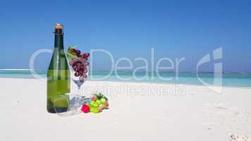 v02787 Maldives beautiful beach background white sandy tropical paradise island with blue sky sea water ocean 4k champagne bottle glass grapes