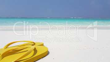 v02931 Maldives beautiful beach background white sandy tropical paradise island with blue sky sea water ocean 4k yellow flip flops