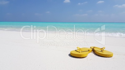 v02935 Maldives beautiful beach background white sandy tropical paradise island with blue sky sea water ocean 4k yellow flip flops