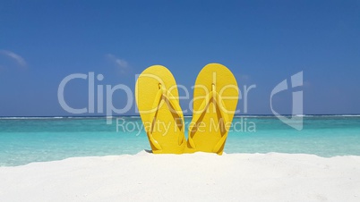 v02937 Maldives beautiful beach background white sandy tropical paradise island with blue sky sea water ocean 4k yellow flip flops