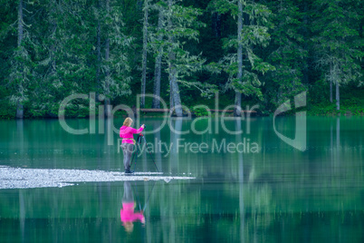 Girl Photographer on the Forest Lake