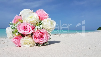 v02995 Maldives beautiful beach background white sandy tropical paradise island with blue sky sea water ocean 4k bouquet flowers