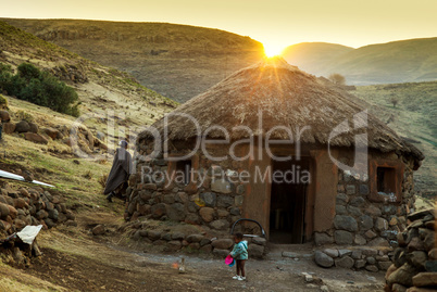 Sunset behind Lesotho hut
