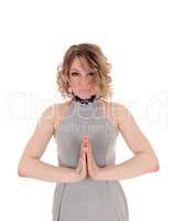 Blond woman praying.