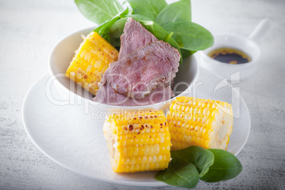 Beef and grilled corn