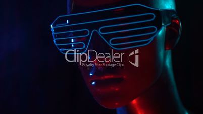 Female mannequin with neon led glasses